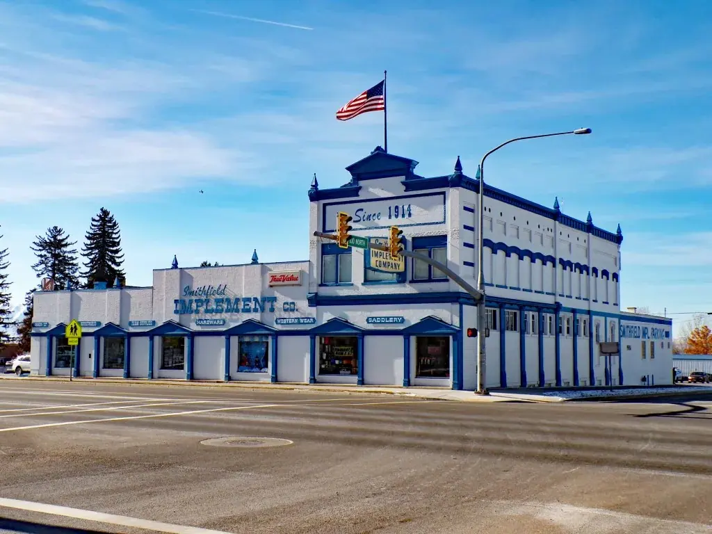 Corner storefront with flag, blue sky